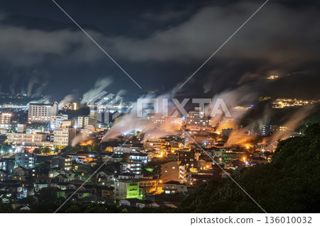 Aerial view of Beppu town with motion steam hot spring at night Aerial view of Beppu town with motion steam hot spring at night 136010032