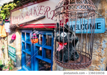 Jiji cat dolls of Kiki Delivery Service in cage at Yufuin floral village 136010038
