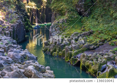 people punt rowboat over blue water of Takachiho gorge, Miyazaki 136010041