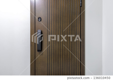Close-up of modern wooden door with electronic smart lock 136010450