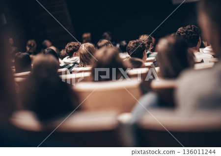 Rear view of unrecognizable people in audience at the conference hall. Business and entrepreneurship symposium 136011244