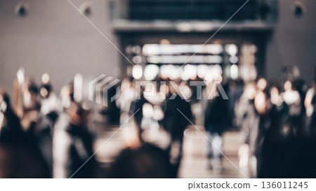 Abstract blurred people at exhibition hall of expo event trade show. Business convention show or job fair. Business concept background 136011245