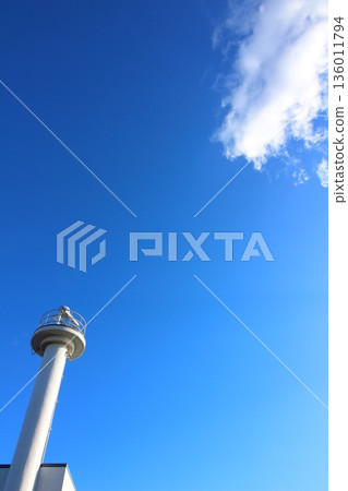 Blue sky, lighthouse and clouds Blue sky, lighthouse and clouds 136011794