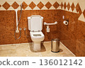 Accessible restroom with grab bars on the wall 136012142