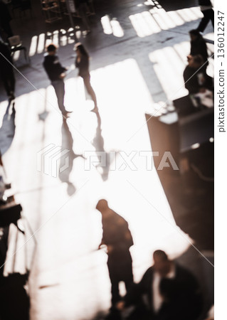 Abstract blurred people at exhibition hall of expo event trade show. Business convention show or job fair. Business concept background 136012247