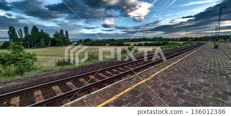 Abandoned Trainstation With Rural Landscape And Lake Balaton In Hungary Abandoned Trainstation With Rural Landscape And Lake Balaton In Hungary 136012386