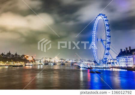 London - River Thames and the London Eye Ferris Wheel at night 136012792