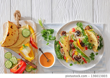 lamb meatball tacos with fresh veggies on a plate lamb meatball tacos with fresh veggies on a plate 136013803