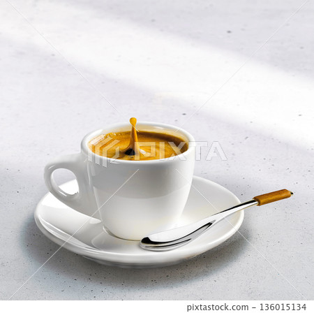 A serene coffee set with one cup on a saucer on a stone under the gentle sunlight A serene coffee set with one cup on a saucer on a stone under the gentle sunlight 136015134