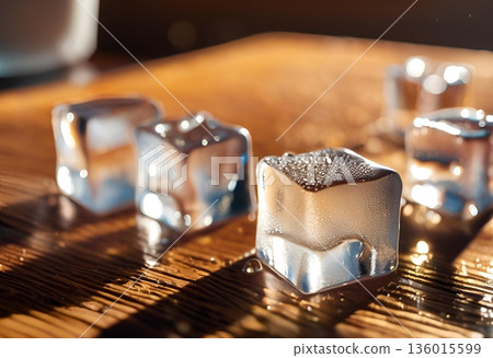 Reusable stainless steel ice cubes chilling drinks without dilution. AI Generated 136015599