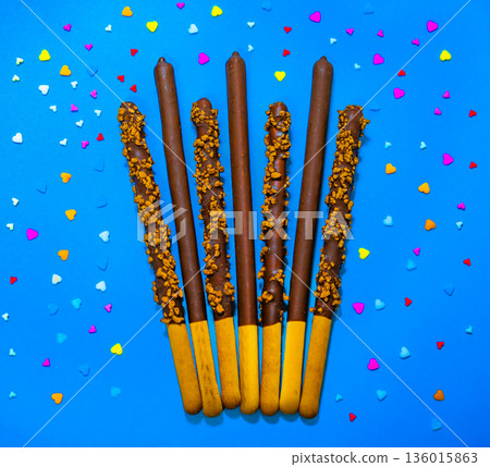 Dropped in chocolate a stick cookie Pepero. November 11th is Pepero Day in Korea 136015863
