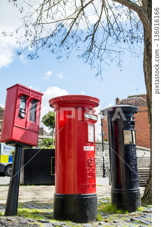 Historic red and navy blue iron postbox in Windsor, a suburb of London 136016166