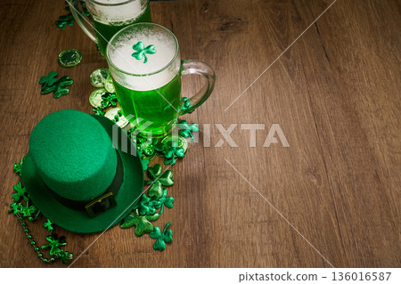 Celebrating st. Patrick's day with green beer and hat Celebrating st. Patrick's day with green beer and hat 136016587