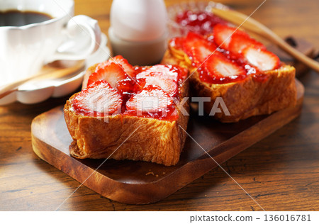 Breakfast image: Strawberry jam and buttered toast topped with fresh strawberries 136016781