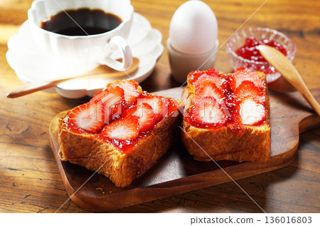 Breakfast image: Strawberry jam and buttered toast topped with fresh strawberries 136016803