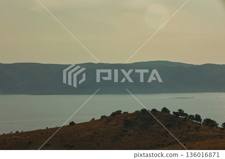 the sea under the mountain on a summer day Vlora, Albania, photographed on August 2025. 136016871