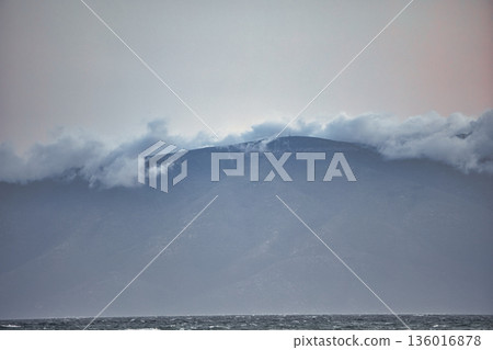 the sea under the mountain on a summer day Vlora, Albania, photographed on August 2025. the sea under the mountain on a summer day Vlora, Albania, photographed on August 2025. 136016878