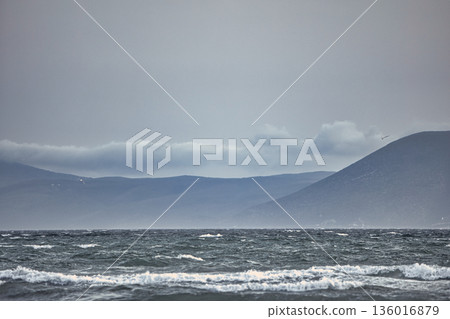 the sea under the mountain on a summer day Vlora, Albania, photographed on August 2025. the sea under the mountain on a summer day Vlora, Albania, photographed on August 2025. 136016879