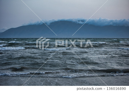 the sea under the mountain on a summer day Vlora, Albania, photographed on August 2025. the sea under the mountain on a summer day Vlora, Albania, photographed on August 2025. 136016890