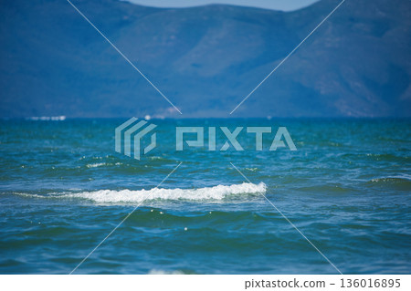 the sea under the mountain on a summer day Vlora, Albania, photographed on August 2025. the sea under the mountain on a summer day Vlora, Albania, photographed on August 2025. 136016895