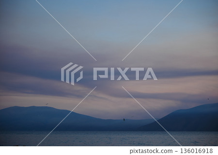 the sea under the mountain on a summer day Vlora, Albania, photographed on August 2025. 136016918