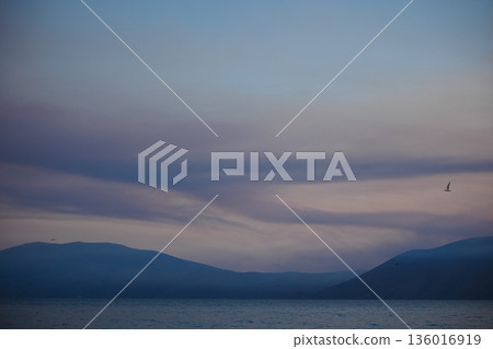 the sea under the mountain on a summer day Vlora, Albania, photographed on August 2025. 136016919