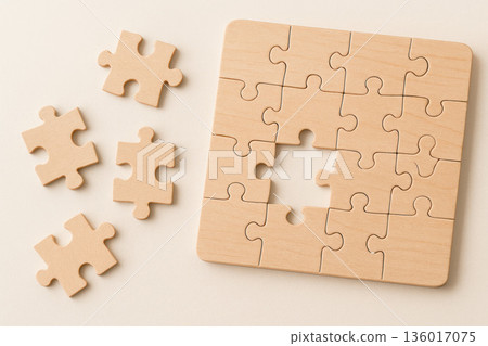 A wooden puzzle with a missing piece. 136017075