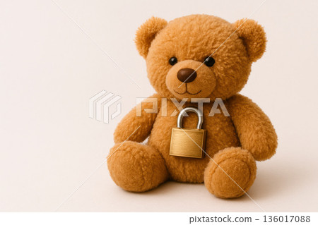 A bear cub with a padlock on his chest. Space for text. 136017088