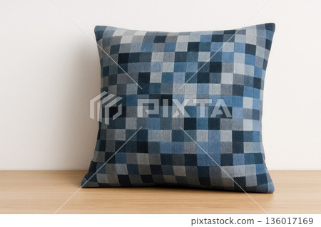 Soft pillow with a square pixel pattern in shades of blue. Soft pillow with a square pixel pattern in shades of blue. 136017169