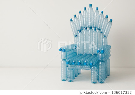 An armchair made of plastic bottles. Space for text. 136017332