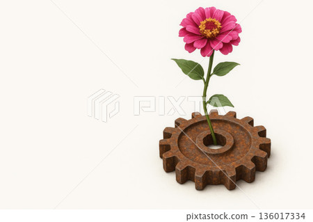 A pink flower grows from a rusty gear. Space for text. 136017334