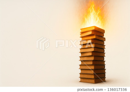 A tall stack of books with a burning top. Space for text. 136017336