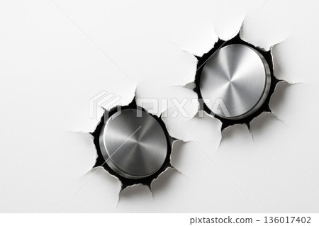 Two metal buttons that pierced the white surface. Space for text. 136017402