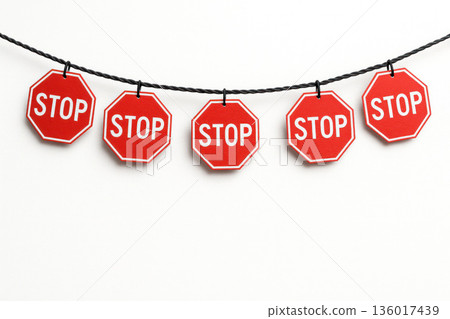 A row of small foot signs on a rope. A row of small foot signs on a rope. 136017439