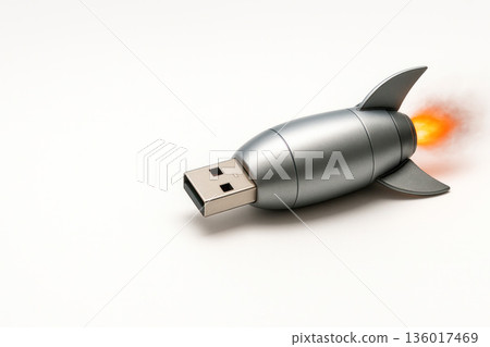Flash drive in the form of a rocket with a fiery flame. Space for text. 136017469