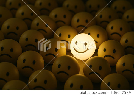 Glowing smiling emoji among sad faces. Glowing smiling emoji among sad faces. 136017589