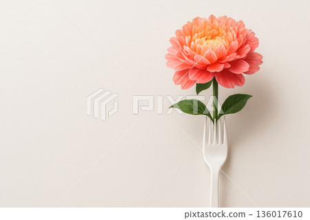 Pink flower on white fork on neutral background. Space for text. Pink flower on white fork on neutral background. Space for text. 136017610
