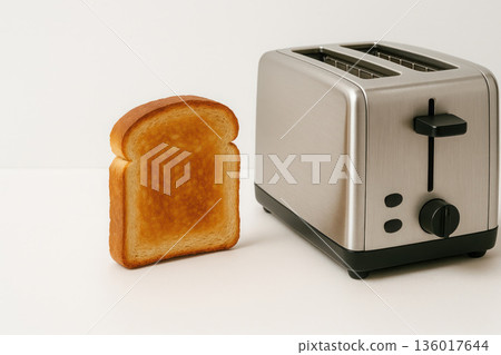 Toasted toast sits next to the toaster. Space for text. Toasted toast sits next to the toaster. Space for text. 136017644