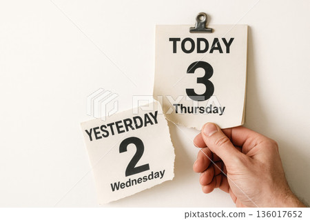 The calendar holds the present day, not letting go of yesterday. Space for text. 136017652