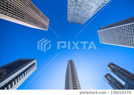 Tokyo cityscape in Japan: Overlooking the Shinjuku business district and Tokyo Metropolitan Government Building. Blue skies spread out. (January 25, 2026) 136018179