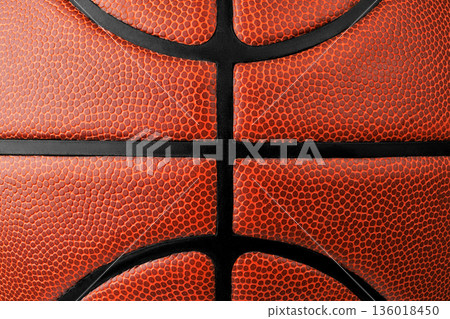 Detailed macro shot showing the texture of an orange basketball ball with black seams 136018450