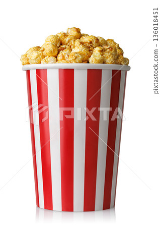 Caramelized popcorn in red and white striped paper cup isolated on white 136018451