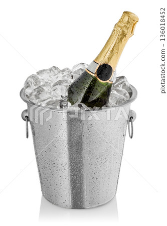 Bottle rests in champagne buckets with ice isolated on white 136018452