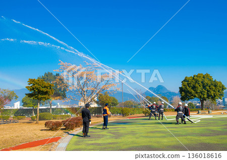 Simultaneous discharge of firefighting first ceremony 136018616