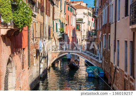 Gondolas on the canals of Venice and the charming streets Gondolas on the canals of Venice and the charming streets 136019257