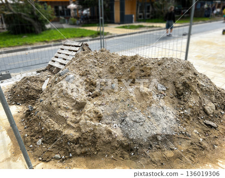 Road construction site with sand and bricks. Repair and maintenance. Process of new road construction 136019306