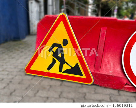 Warning road construction sign, danger sign in city. 136019311