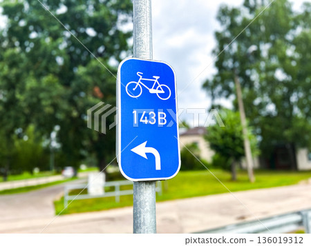 Path for cyclists. Blue road sign in urban environment. Traffic sign isolated in European city Path for cyclists. Blue road sign in urban environment. Traffic sign isolated in European city 136019312