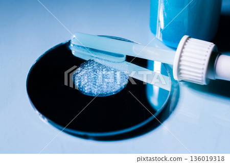 Close up of Blue Copper Peptides GHK-Cu in Pipette. Beauty serum for anti aging beauty routine 136019318