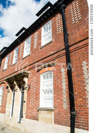 Historic red brick buildings under bright sunlight in Windsor, a suburb of London 136019806